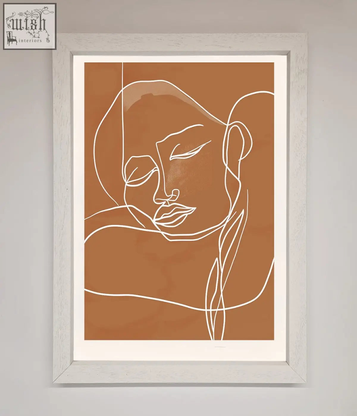 Minimalist sepia lines framed wall art with white abstract face on terracotta background in a gray wooden frame