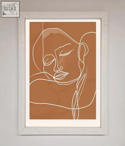 Minimalist sepia lines framed wall art with white abstract face on terracotta background in a gray wooden frame