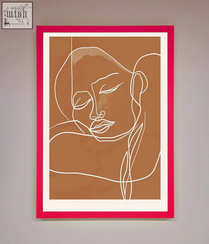 A minimalist sepia lines framed wall art with abstract face line art in a vibrant pink frame on warm brown background