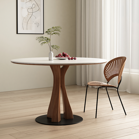 Seraphim round dining table with a white marble top and sculptural walnut wood base perfect round dining table