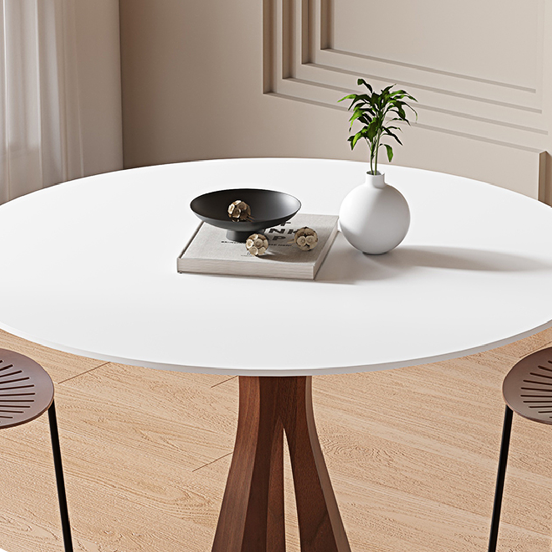 White round dining table with wooden tripod base perfect for modern seraphim round dining setup