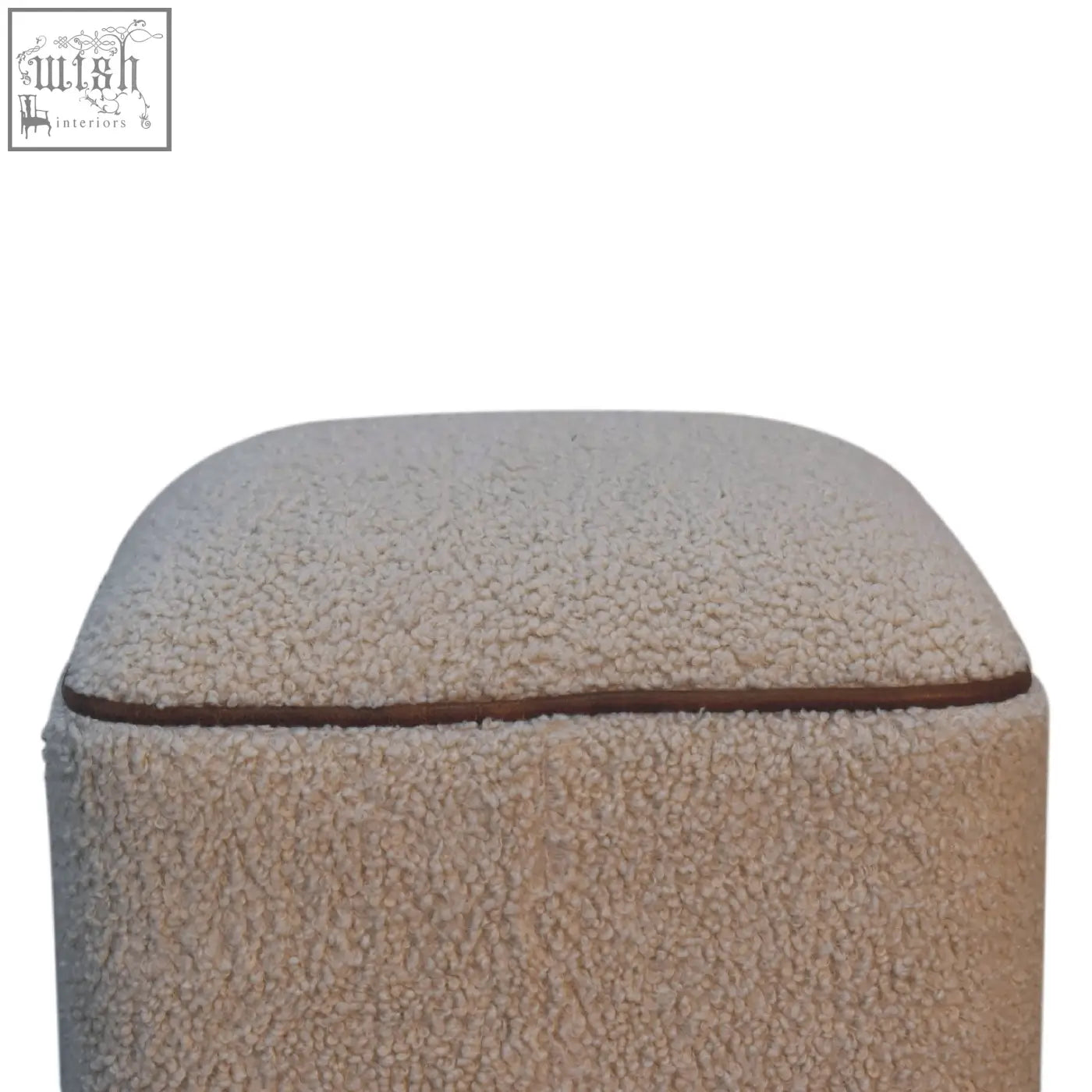 Beige faux fur serenity footstool with brown leather trim and unique ball feet in handwoven upholstered design