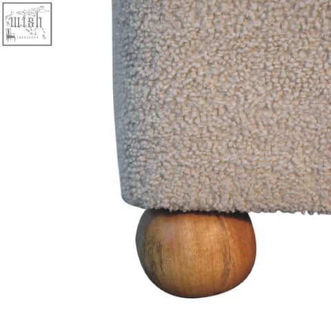 Beige textured fabric serenity footstool with unique polished wooden ball feet and handwoven upholstered design