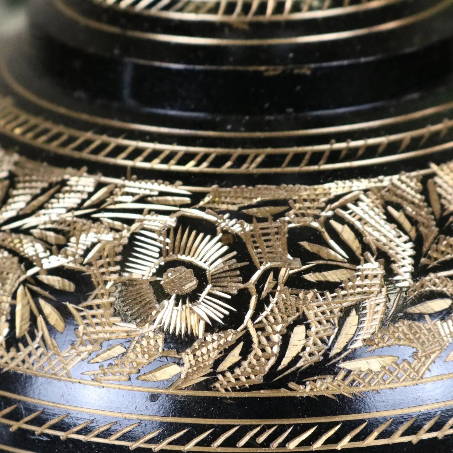 Black lacquered etched brass vase with intricate gold leaf floral patterns part of set of 2 black etched brass vases