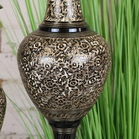 A set of 2 black etched brass vases in 40cm and 50cm with intricate floral engravings and a glossy black neck band