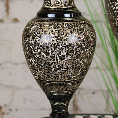 Ornate black etched brass vase with intricate floral engravings and glossy black base from set of 2 brass vases