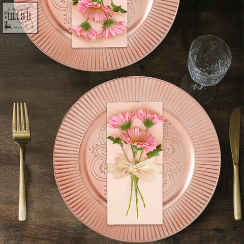 Set of 4 redbud rose gold metallic charger plates with wide surface area and embossed floral pattern on fluted rim