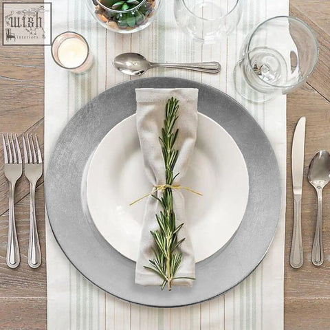 Silver-toned ceramic charger plates with matte distressed finish and concentric ridges to protect table surfaces