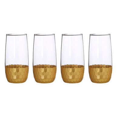 Set of four clear astrid highball glasses with gold honeycomb pattern at the base perfect for cocktails