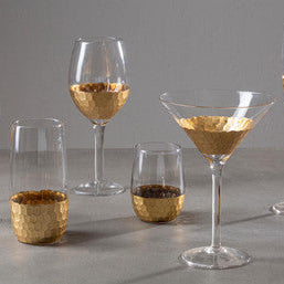 Set of four astrid highball glasses with gold leaf martini and wine glasses featuring hammered metallic bases