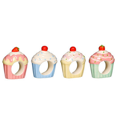 Set of four cupcake napkin rings in pastel ceramic with glossy frosting and cherry or strawberry tops