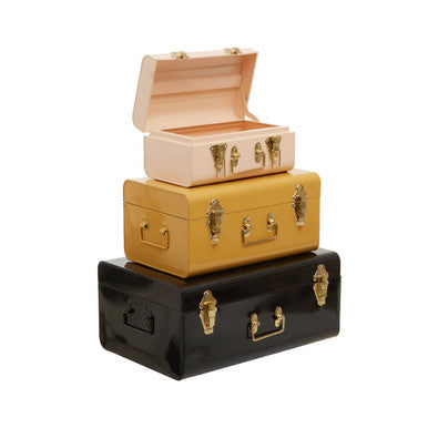 Set of three assorted storage trunks in pastel pink mustard yellow and black with gold-tone hardware by parley