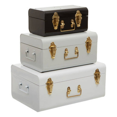 Stacked vintage-style three monochrome storage trunks in white grey and black with gold-tone hardware by parley