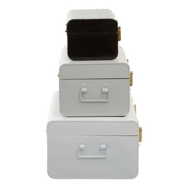 Stacked white metal storage trunks with gold-tone latches and black interior in a set of three monochrome storage trunks by parley