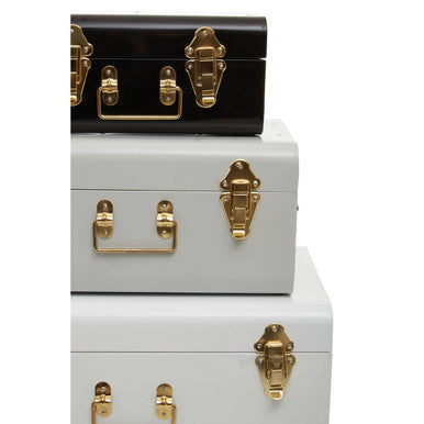 Stacked set of three monochrome storage trunks in white grey and black with vintage metal and gold hardware by parley