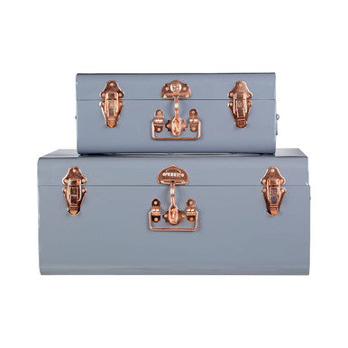 Set of two grey storage trunks in light blue metal with rose gold-tone latches and handles for stylish storage