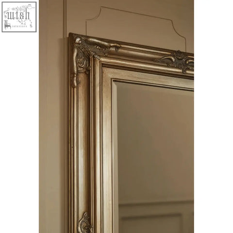 Antique-style sevan wood frame wall mirror with ornate gold carved detailing along the border