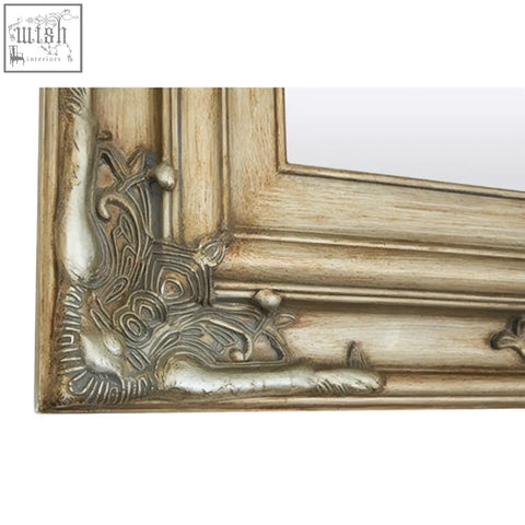 Antique style sevan wood frame wall mirror with ornate carved details and distressed white wood frame finish