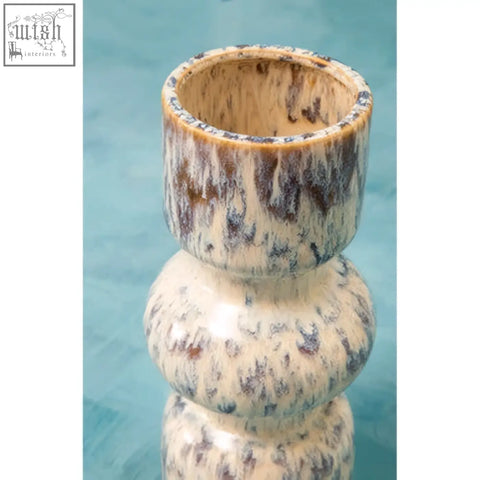 Cream-colored ceramic medium speckled vase with mottled brown and gray glaze and stacked rounded sections