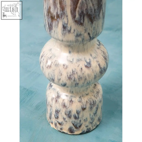 Cream-colored ceramic medium speckled vase with a mottled pattern of dark gray and brown for decor use