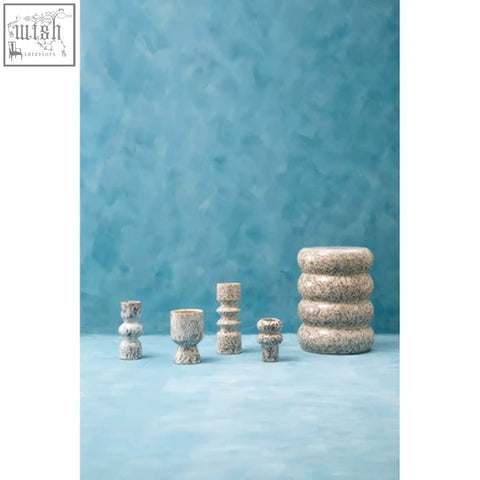 Set of small speckled vase ceramic candle holders in gray with textured designs in varying heights