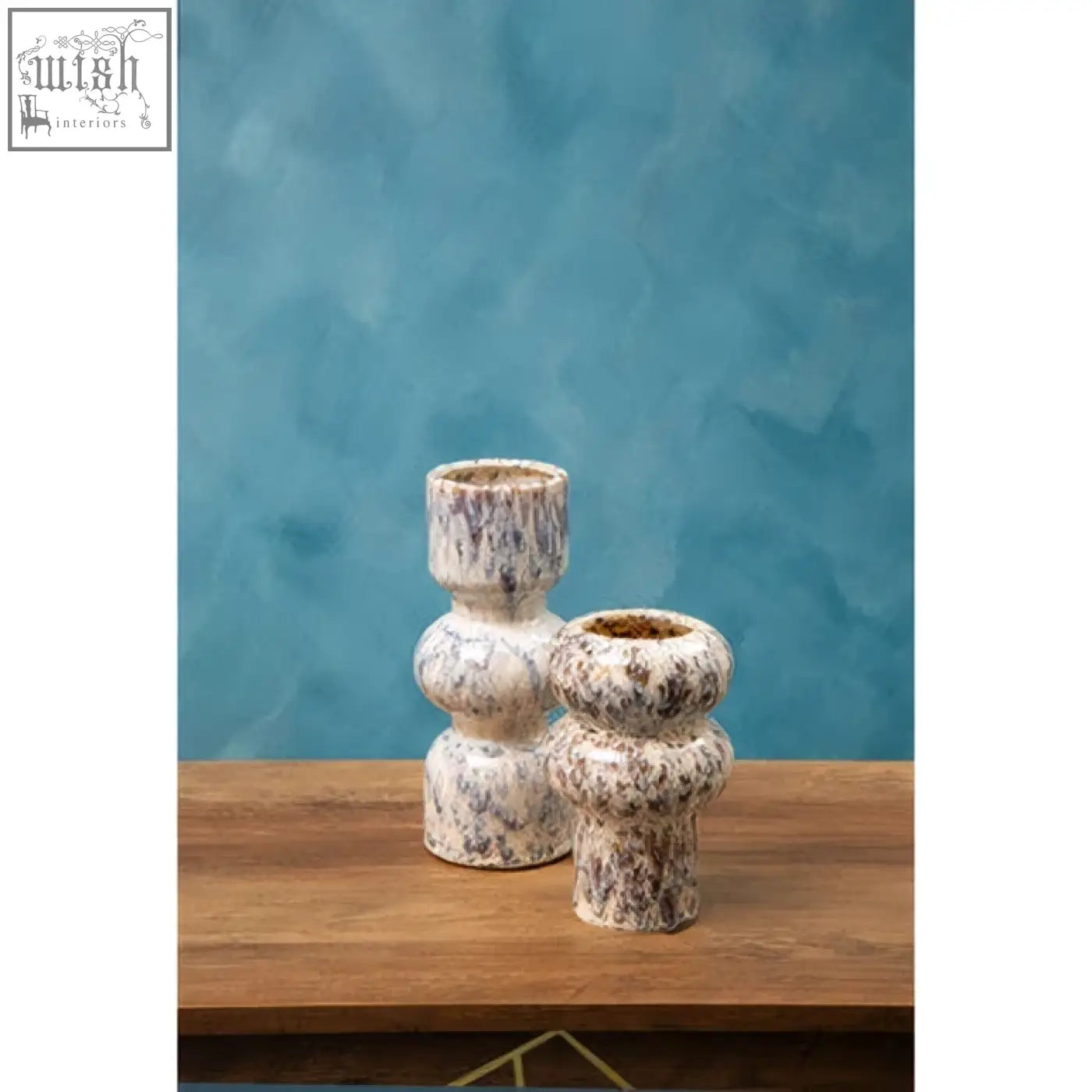 Two small speckled ceramic candle holders with a textured rounded design perfect as a small speckled vase alternative