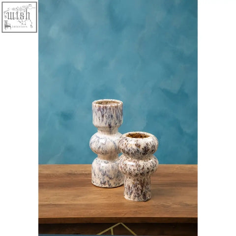 Two small speckled ceramic candle holders with a textured rounded design perfect as a small speckled vase alternative