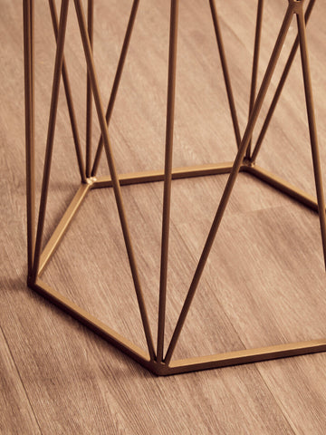 Gold-toned shalimar marble top side table with geometric base and open lattice design featuring a marble surface