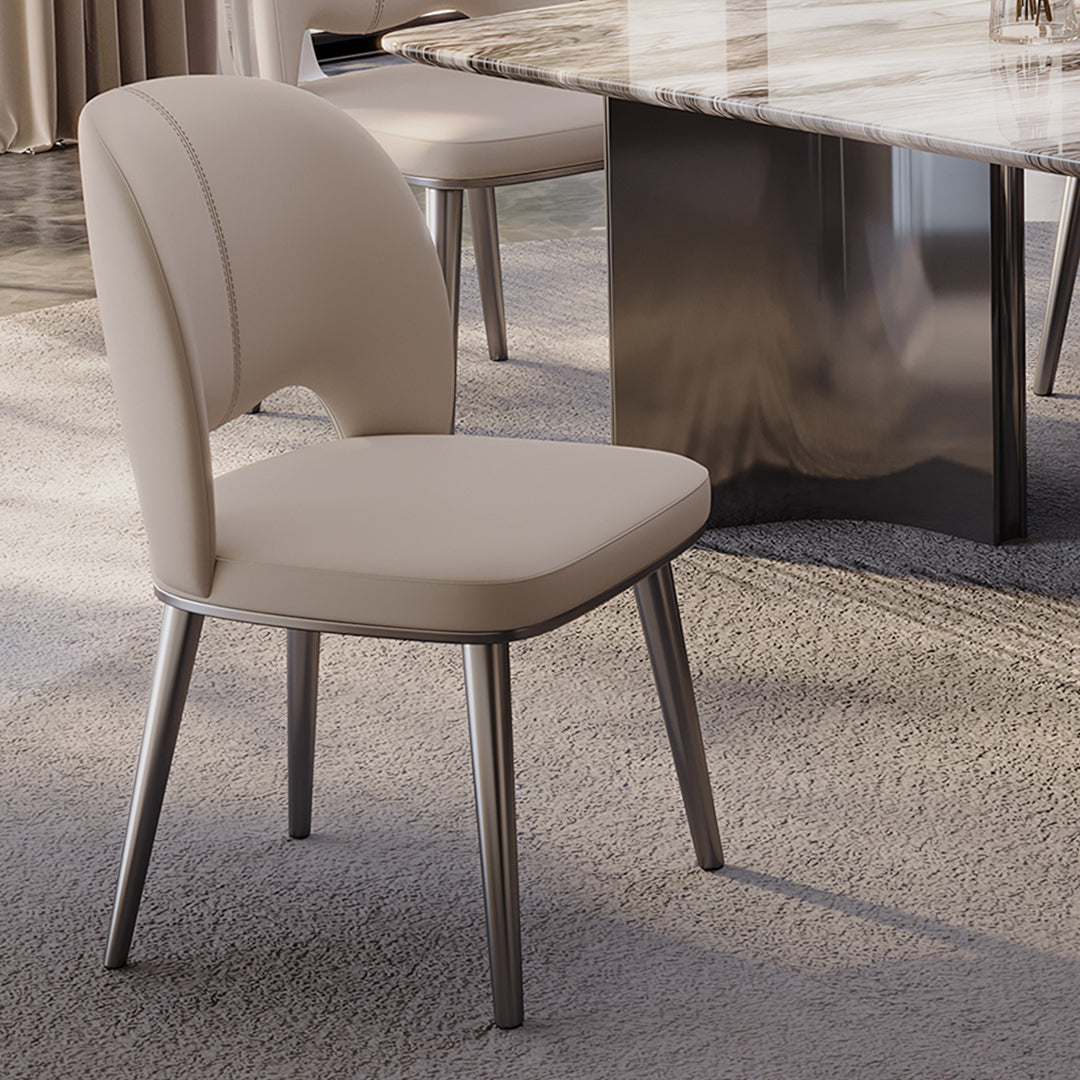 Cream-colored shankar leather dining chair with sleek metallic legs available in more leg colours