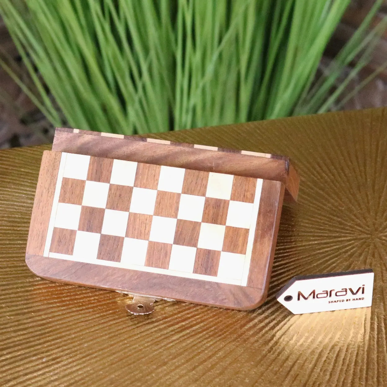 Shatranj folding wooden chess set 14cm with keyhole features a folding wooden chessboard in light and dark brown wood squares