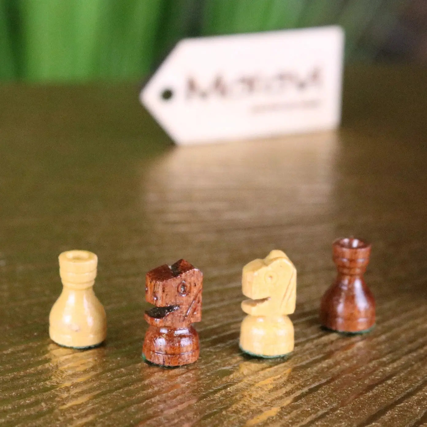 Set of four miniature wooden chess pieces in light and dark brown for shatranj folding wooden chess set 14cm