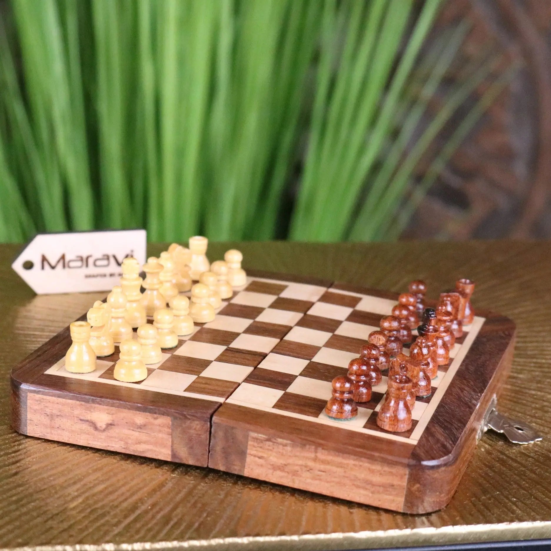 Portable folding wooden chess set with light and dark brown pieces on a foldable board 14cm shatranj design