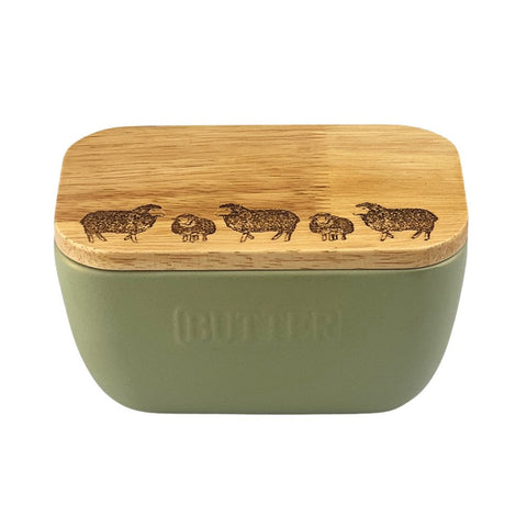 Olive green ceramic butter dish with bamboo lid featuring engraved sheep designs for kitchen use