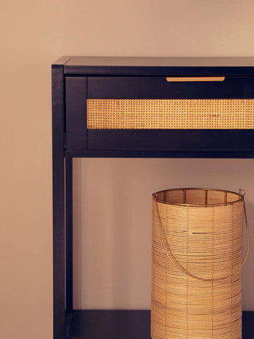 Dark blue sherman black wood and rattan two drawer console table with woven rattan fronts and gold-tone handles