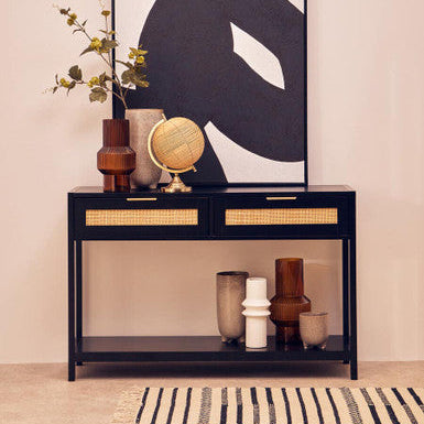 Black sherman wood and rattan two drawer console table with woven rattan fronts and lower open shelf