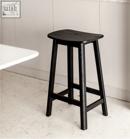 Black wooden shina bar stool with smooth curved seat and four sturdy legs perfect for home bars or kitchens