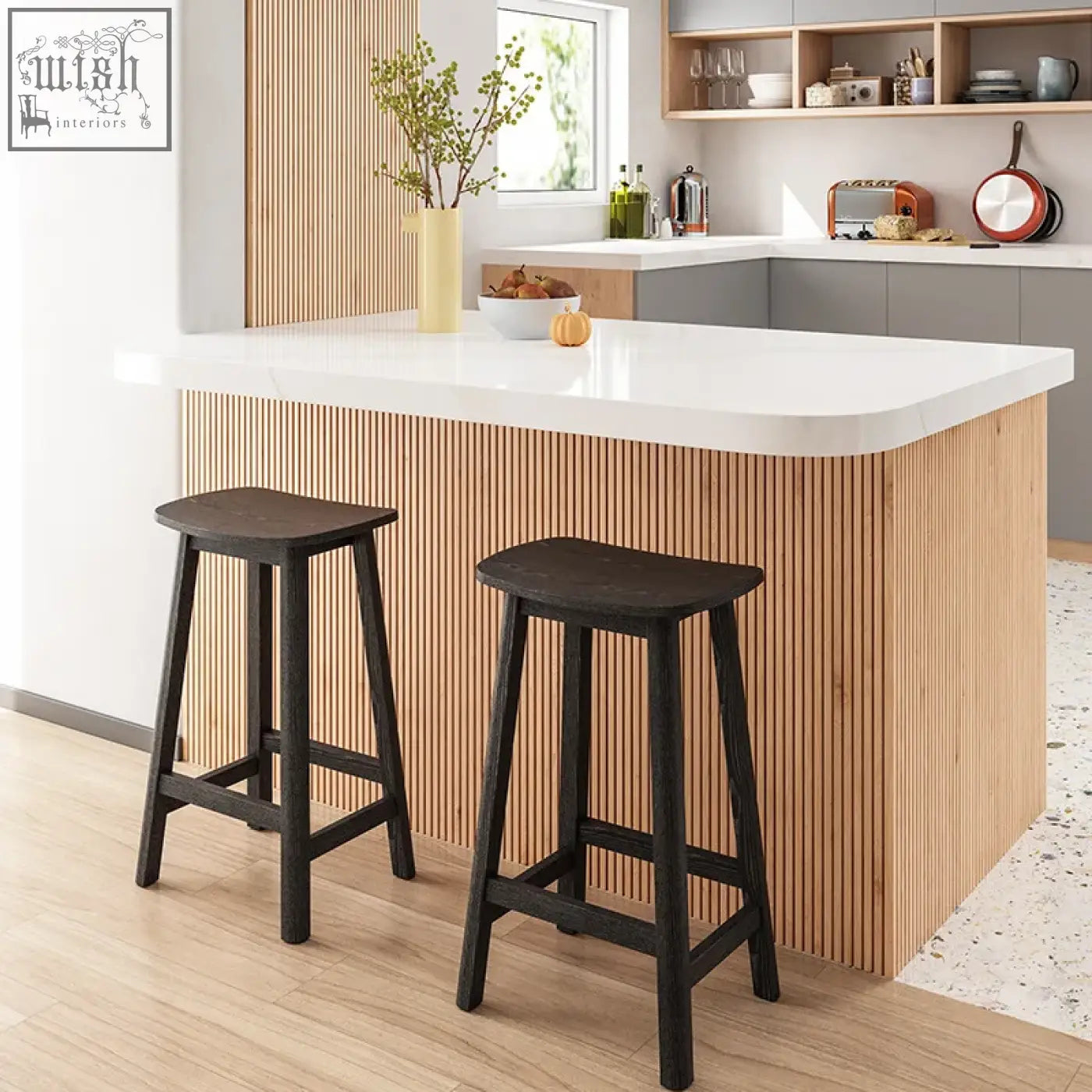 Two dark wooden shina bar stools with simple sturdy design in front of a modern kitchen island for shina bar use