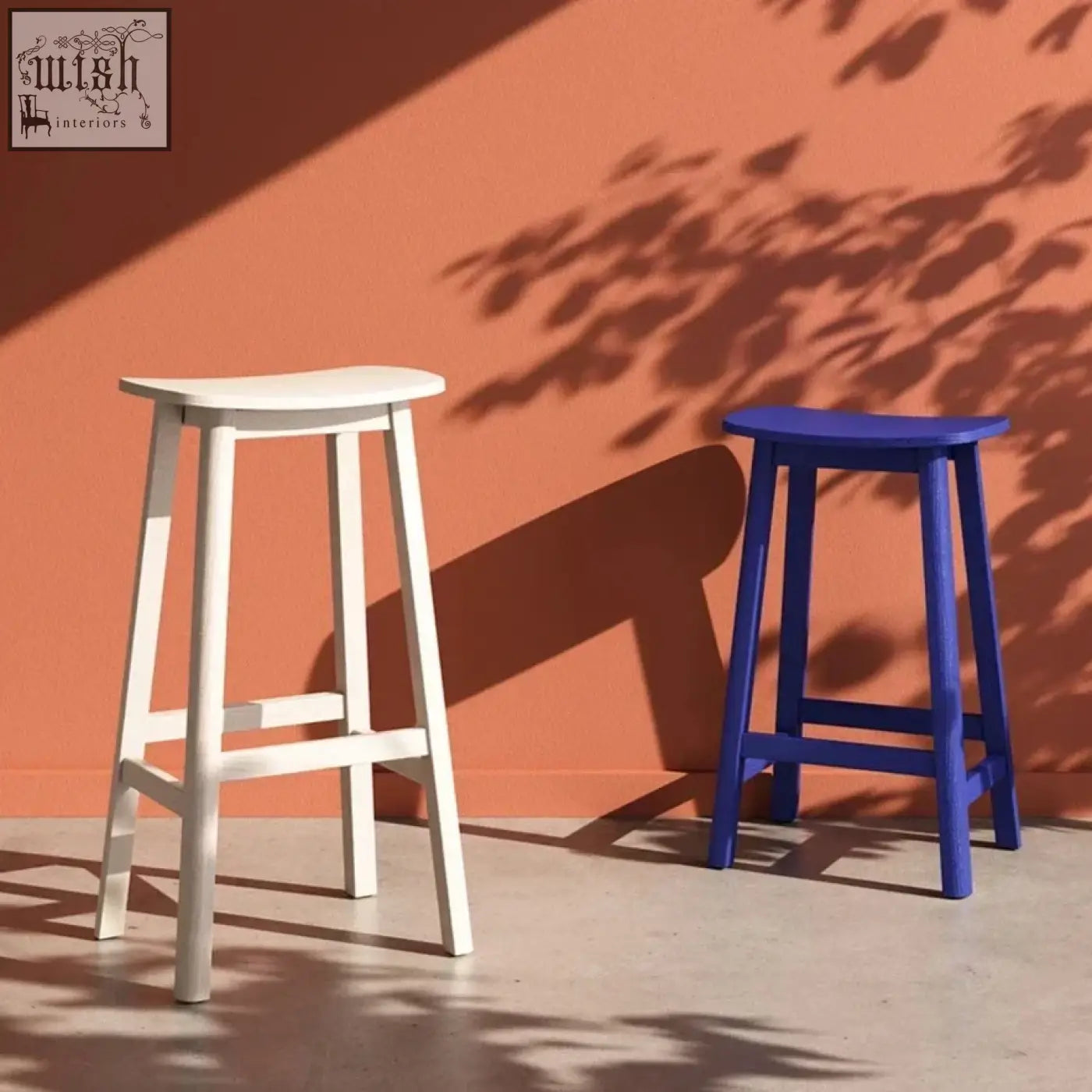 Two minimalist wooden shina bar stools in white and royal blue perfect for stylish bar seating