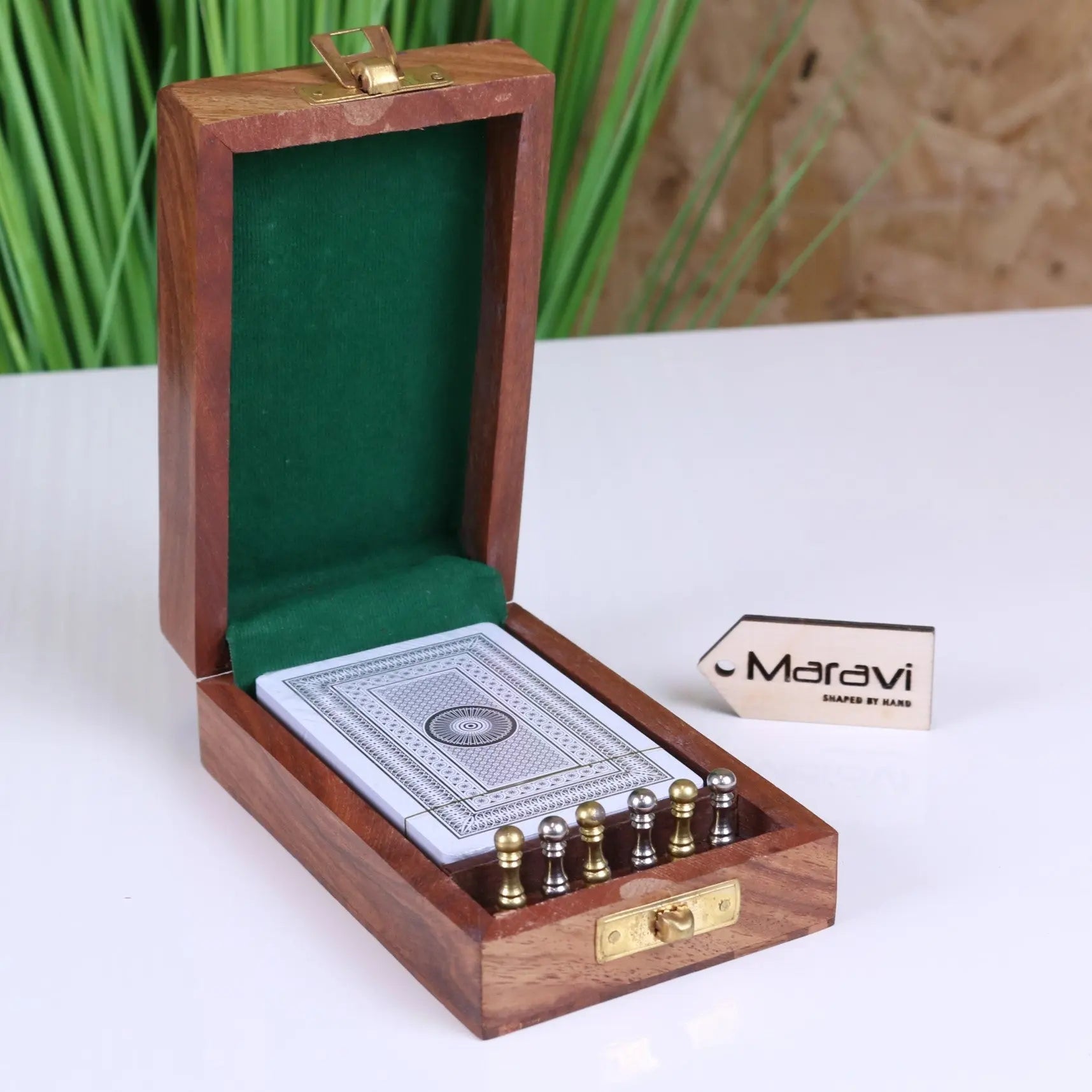 Wooden travel cribbage set with brass pieces in a green velvet-lined folding box perfect for travel cribbage fun