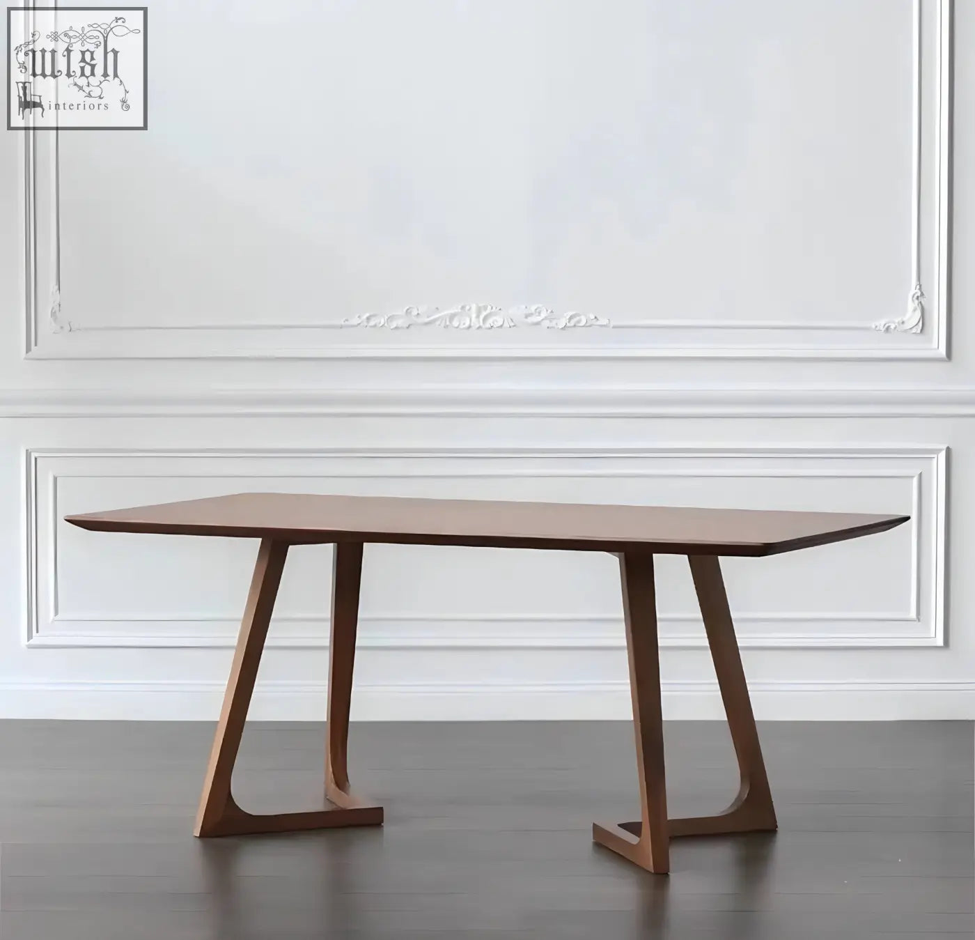 A sleek shoko dining table with rich walnut finish and distinctive angular legs perfect for modern dining spaces