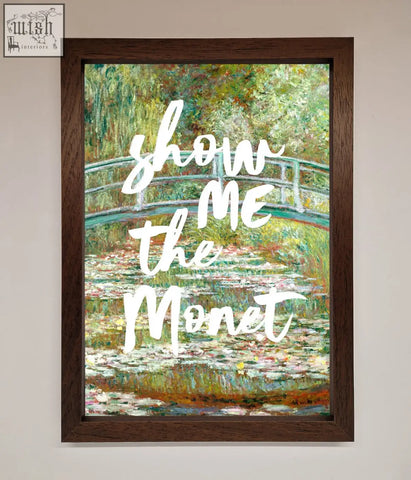 A dark brown framed poster of a monet framed featuring a water lily pond and arched bridge with show me the monet text