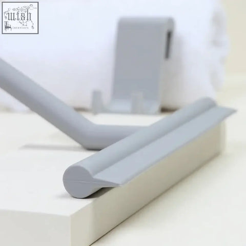 Gray silicone shower squeegee with sleek rounded edges for window glass wiper and bathroom mirror cleaning