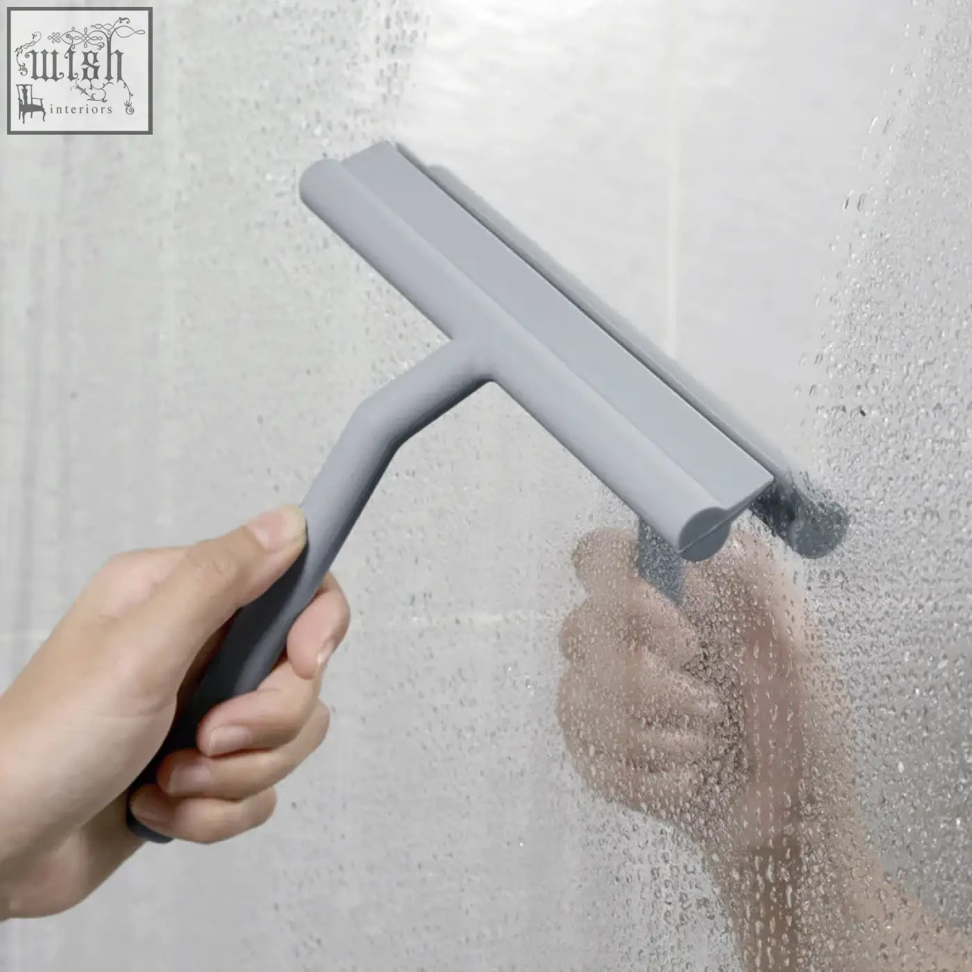 Gray silicone shower squeegee with curved handle designed as a window glass wiper for cleaning glass surfaces