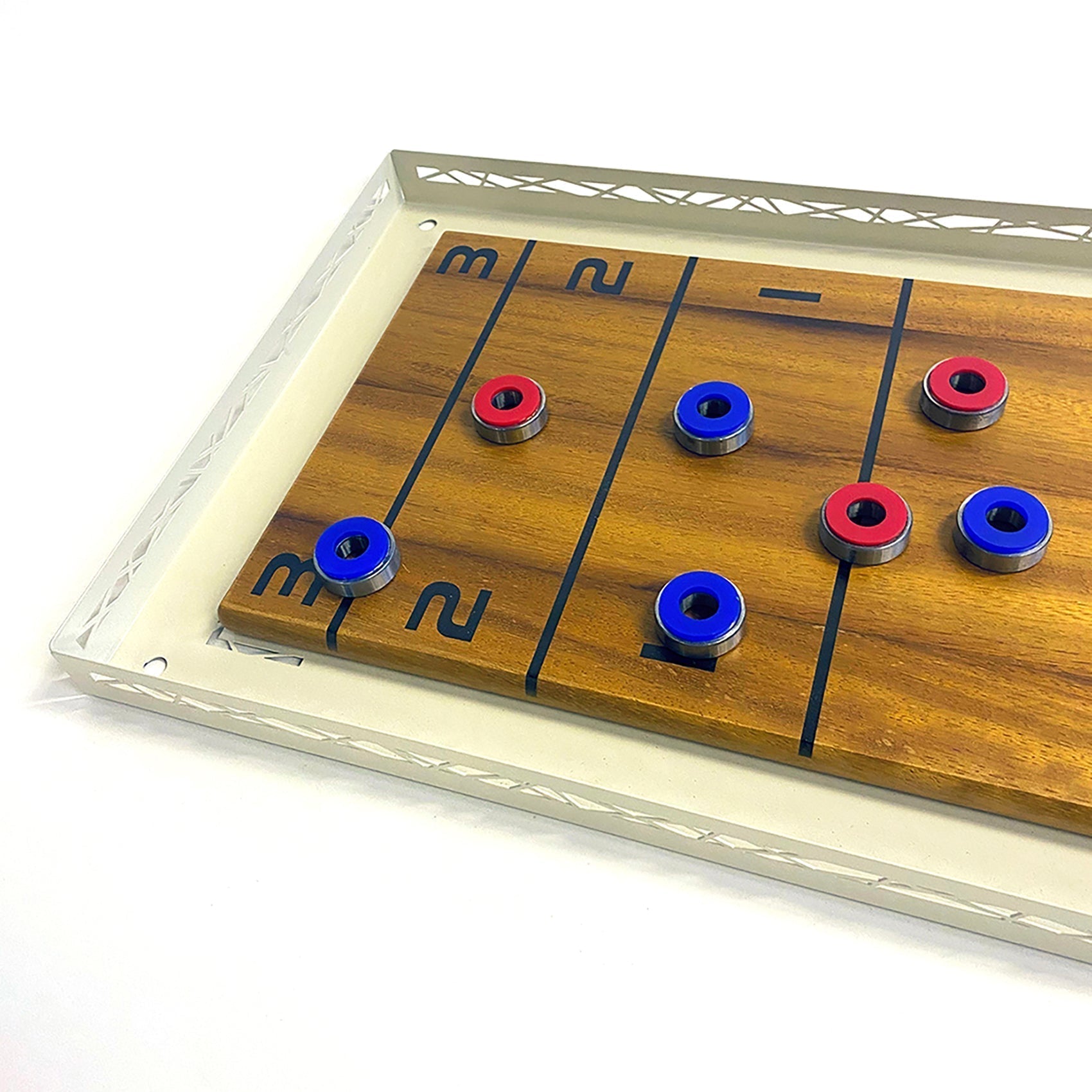 Wooden shuffle board game with cream metal frame and red blue pucks for fun play and easy hanging instructions