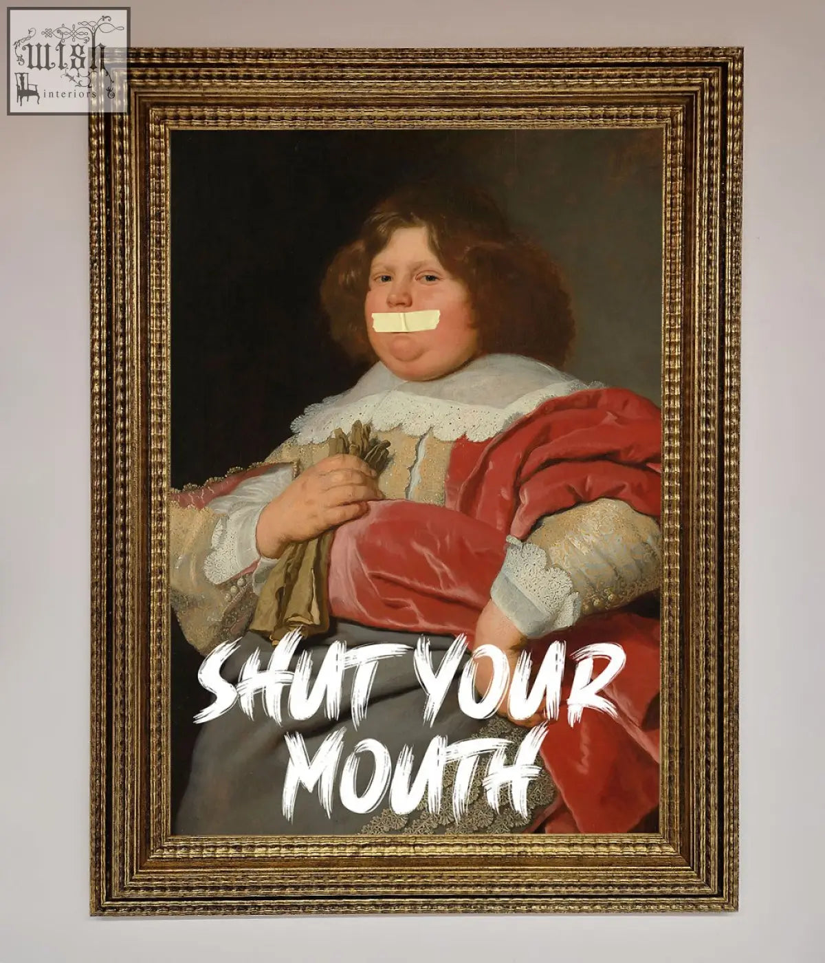 A bold statement mouth framed print featuring a child in ornate red and gold attire with tape over their mouth