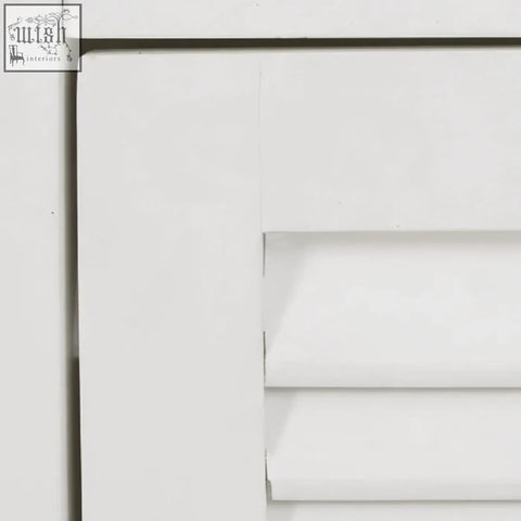 White painted wooden shutter with clean edges and horizontal slats for a white wood floor cabinet