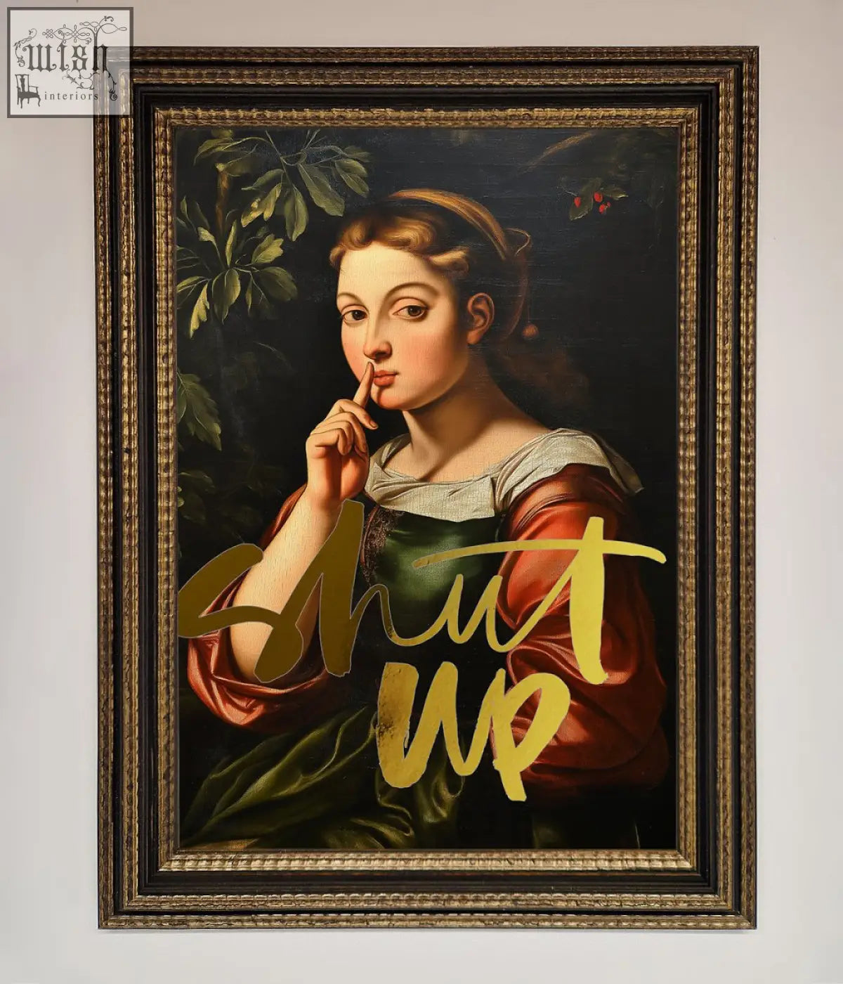 A framed shutup foil print featuring a classical woman in red and green attire with gold lettering shut up