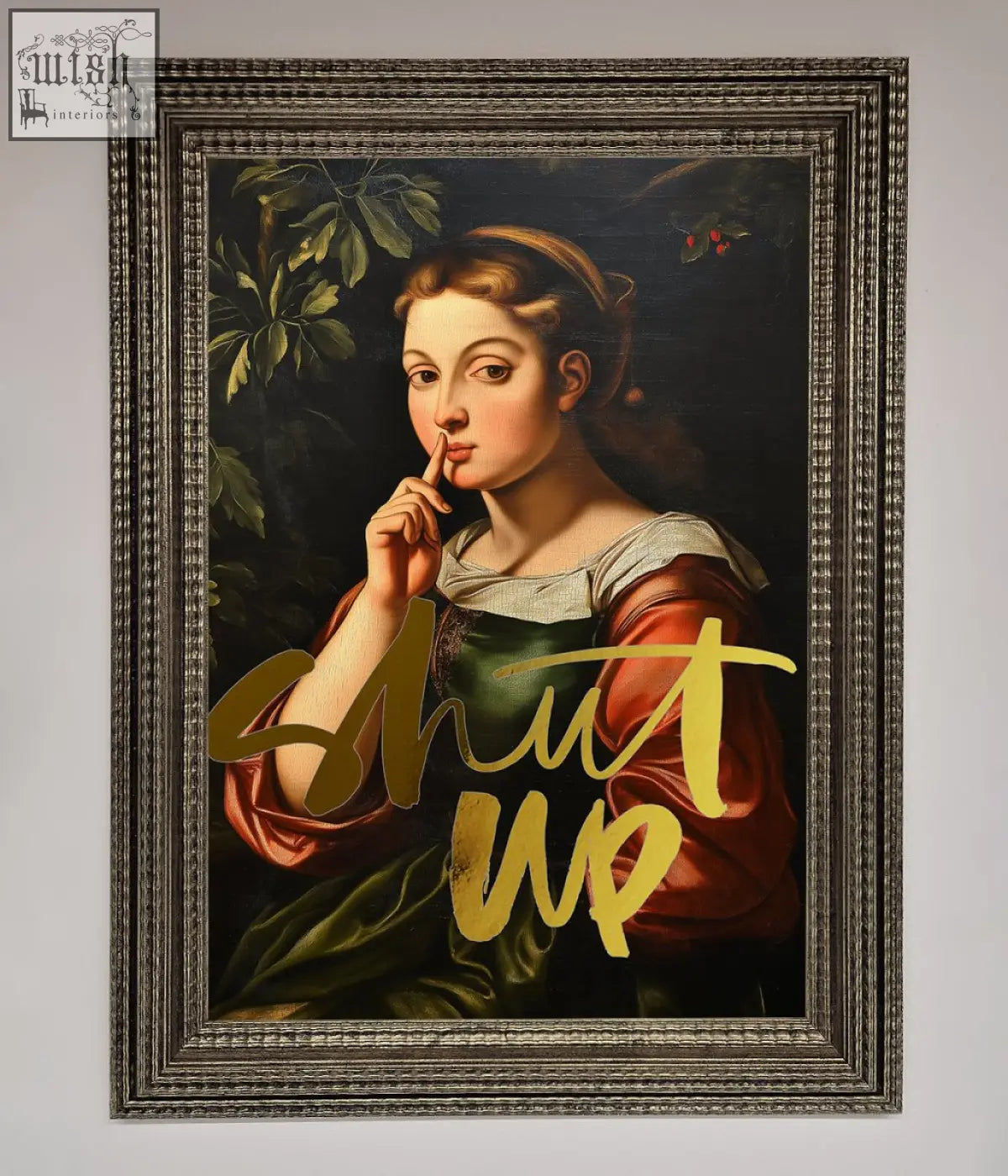 A framed shutup foil print featuring a classical woman in red and green with gold shutup foil script overlay