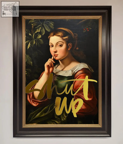 A framed shutup foil print featuring a classical woman in red and green with gold lettering shutup on foil print