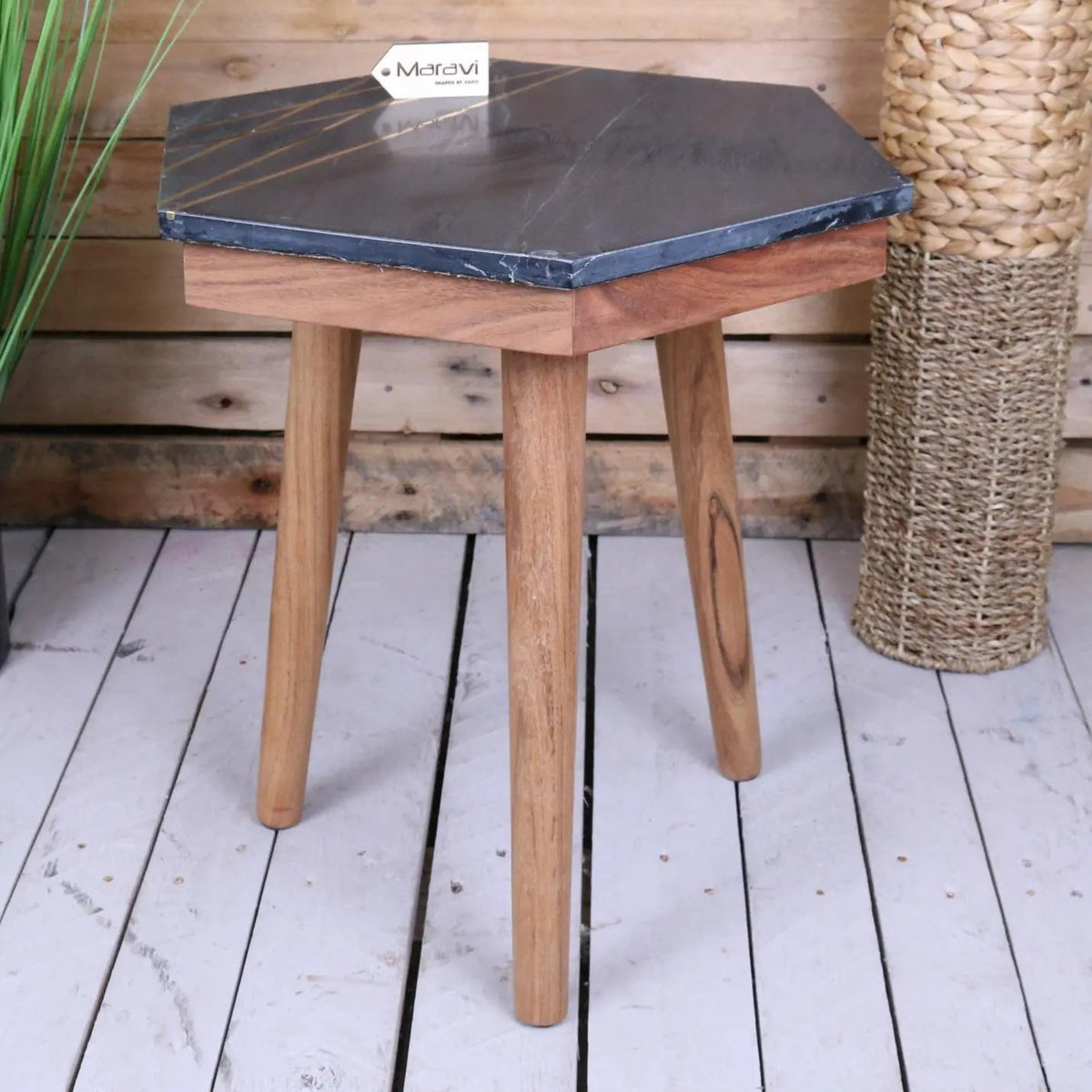 Siangra hexagon black marble side table with dark gray marble top and light wood legs with gold tone accents